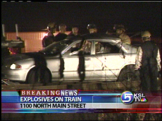 Train Carrying Explosives Collides with Car
