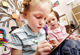 Twins Jessica, left, and Jaden Mecham work on writing at Hayden Peak. (Photo by Scott G. Winterton, Deseret Morning News)