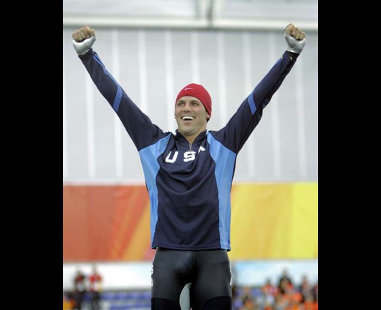 Gold medalist Chad Hedrick of the United States reacts during the presentation of the flowers to the medal winners at the men's 5000 meter speedskating at Oval Lingotto during the 2006 Winter Olympics in Turin, Italy on Saturday, Feb. 11, 2006. The medal ceremony will take place on Sunday. (AP Photo/Jasper Juinen)