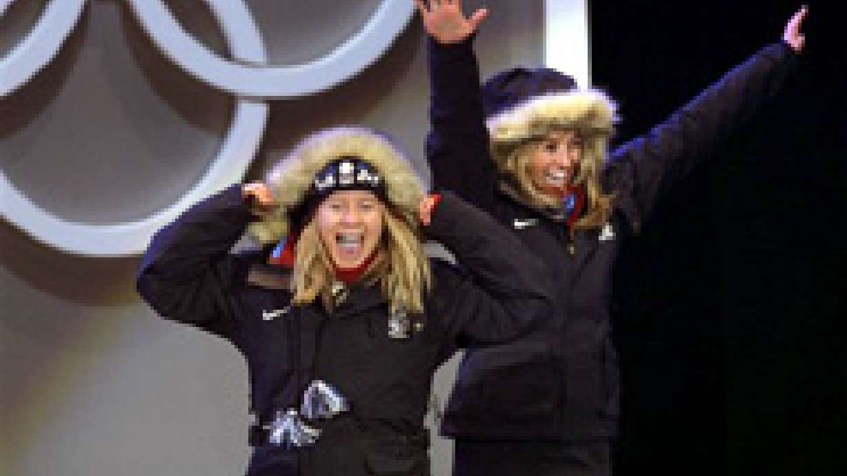 Women Snowboarders Wearing Medals, Big Smiles