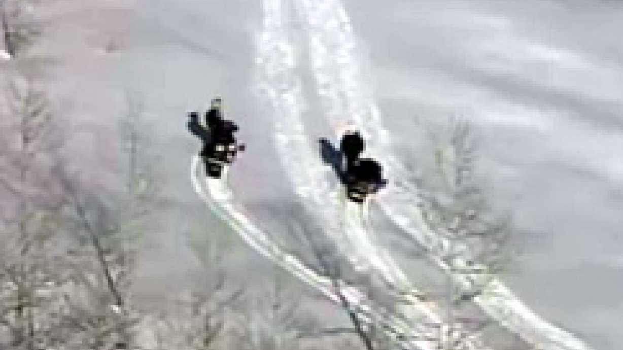 Snowmobiler Drives Off Cliff