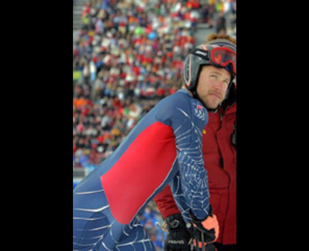 Bode Miller of the United States leaves the finish area after skiing out of the course during the first run of the Men's Giant Slalom.