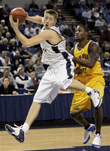 Utah State's Mike Harris, left, pulls down a rebound against San Jose State's Demetrius Brown during the first half of a Western Athletic Conference tournament basketball game in Reno, Nev., Thursday, March 9, 2006. (AP Photo/Rich Pedroncelli)