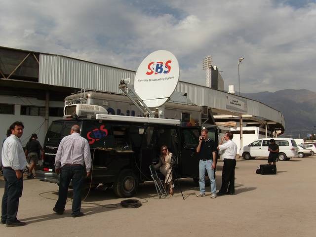 KSL-5's Carole Mikita (sitting in door of van) and Brian Hyer (standing to the left of Carole) prepare for a live shot from Santiago, Chile.