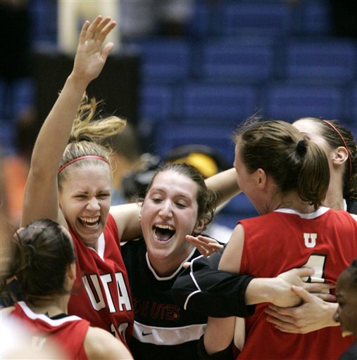 Utah's Shona Thorburn, left arm raised, and Kim Smith, right, are mobbed by teammates after they defeated Arizona State 86-65 in their second round NCAA Tournament basketball game in Tucson, Ariz., Monday, March 20, 2006. Utah advances to a regional semifinal game next weekend in Albuquerque(AP Photo/Charles Rex Arbogast)