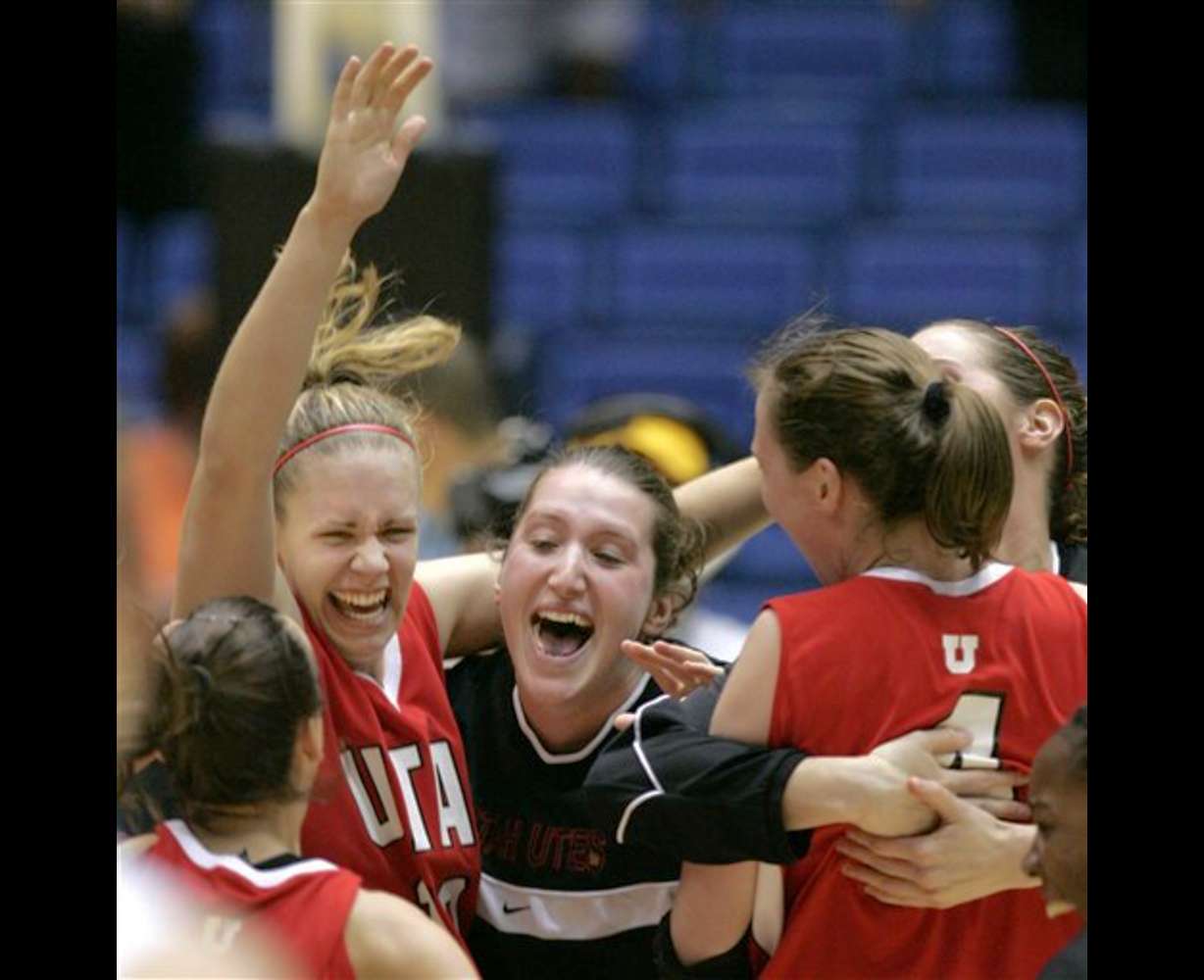Utah's Shona Thorburn, left arm raised, and Kim Smith, right, are mobbed by teammates after they defeated Arizona State 86-65 in their second round NCAA Tournament basketball game in Tucson, Ariz., Monday, March 20, 2006. Utah advances to a regional semifinal game next weekend in Albuquerque(AP Photo/Charles Rex Arbogast)