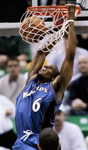 Washington Wizards guard Antonio Daniels (6) dunks against the Utah Jazz during the fourth quarter of an NBA basketball game Thursday, March 23, 2006, in Salt Lake City. Arenas scored 31 points for the game high. The Wizards beat the Jazz 109-97. (AP Photo/Douglas C. Pizac)