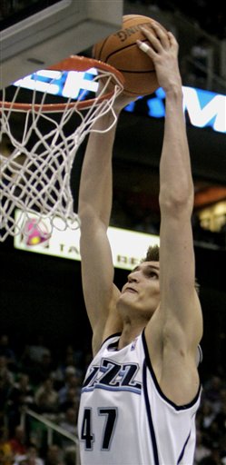 Utah Jazz forward Andrei Kirilenko (47), of Russia, dunks one against the New Orleans Hornets during the third quarter of their NBA basketball game Monday, March 27, 2006, in Salt Lake City. The Jazz beat the Hornets, 104-80. (AP Photo/Douglas C. Pizac)