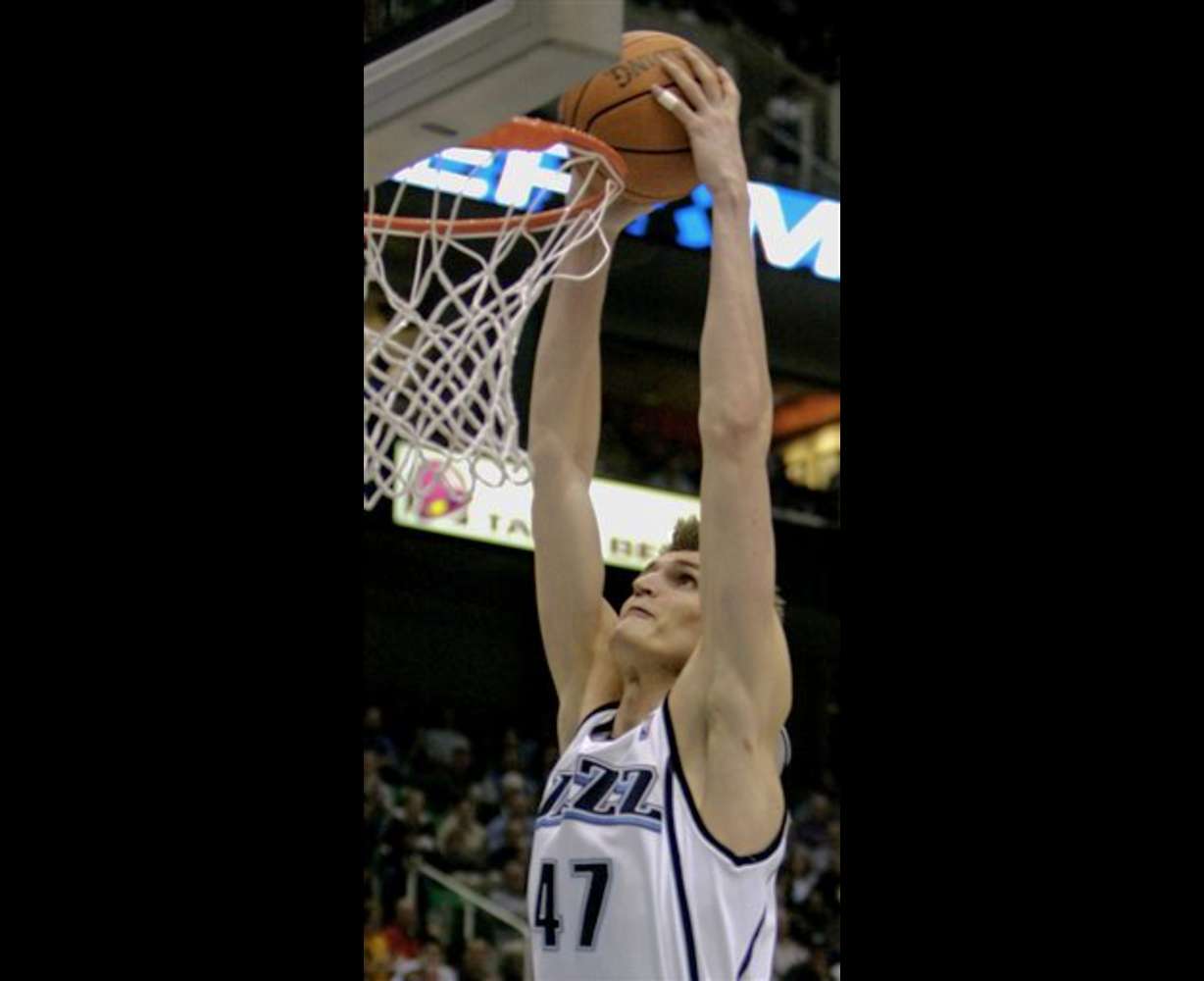 Utah Jazz forward Andrei Kirilenko (47), of Russia, dunks one against the New Orleans Hornets during the third quarter of their NBA basketball game Monday, March 27, 2006, in Salt Lake City. The Jazz beat the Hornets, 104-80. (AP Photo/Douglas C. Pizac)