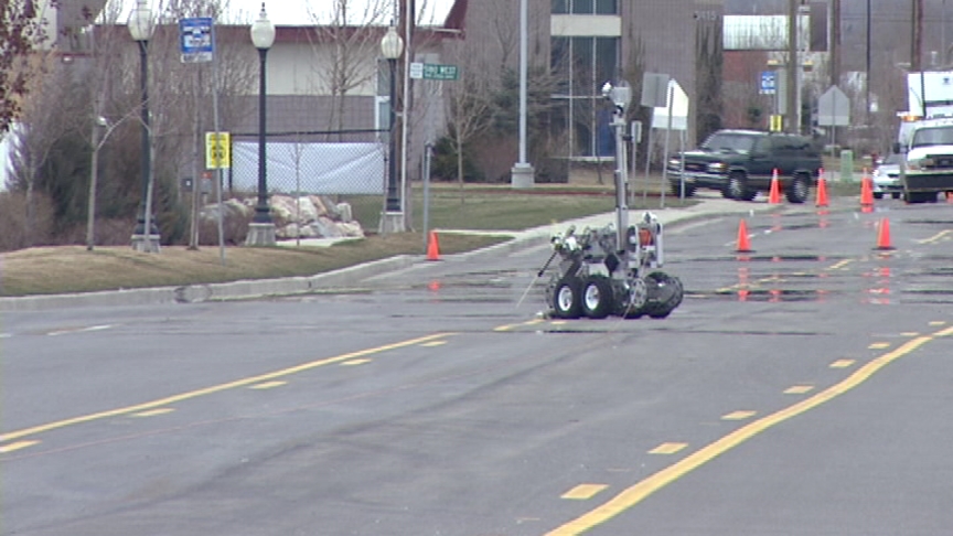 Man Finds Suspicious Package in Road