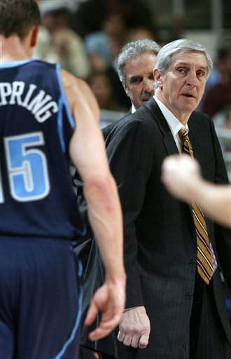 Utah Jazz head coach Jerry Sloan, center, casts a look at forward Matt Harpring, front, as he returns to the bench while assistant coach Phil Johnson, back, looks on in the first quarter of an NBA basketball game against the Denver Nuggets in Denver on Wednesday, March 29, 2006. (AP Photo/David Zalubowski)