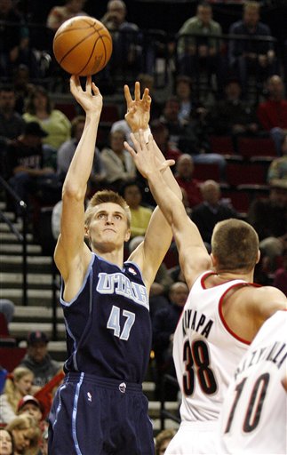 Utah Jazz's Andrei Kirilenko (47), of Russia, shoots over Portland Trail Blazers' Viktor Khryapa (38) in the first quarter of their NBA basketball game Saturday, April 1, 2006, at the Rose Garden, in Portland, Ore. The Jazz defeated the Trail Blazers, 102-89. (AP Photo/Rick Bowmer)