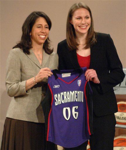 Utah's Kim Smith, right, is presented with a Sacramento Monarchs jersey by WNBA President Donna Orender, left, after Smith was chosen as the No. 13 pick in the WNBA draft by Sacramento, Wednesday, April 5, 2006, in Boston. (AP Photo/Josh Reynolds)