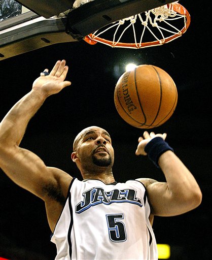 Utah Jazz forward Carlos Boozer dunks in the fourth quarter for two of his game-high 30 points in their victory over the Minnesota Timberwolves, 103-95, in NBA action in Minneapolis, Friday, April 7, 2006.(AP Photo/Andy King)