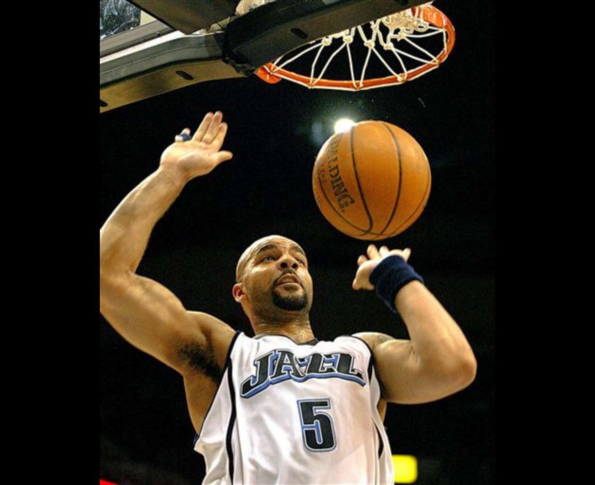 Utah Jazz forward Carlos Boozer dunks in the fourth quarter for two of his game-high 30 points in their victory over the Minnesota Timberwolves, 103-95, in NBA action in Minneapolis, Friday, April 7, 2006.(AP Photo/Andy King)