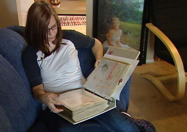 Stephanie Amandia Cook looks at the only photos she has of her mother.