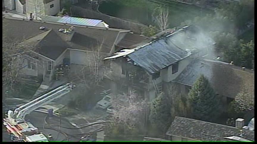 Firefighters Return Next Day to Extinguish Smoldering Roof