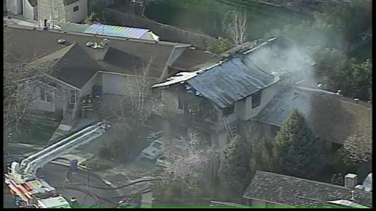 Firefighters Return Next Day to Extinguish Smoldering Roof