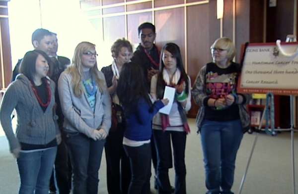 West High students gather for the presentation of their donation to the Huntsman Cancer Foundation.