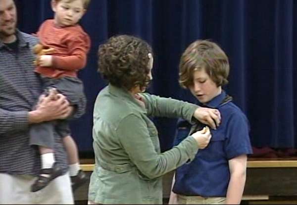 April Kelvan pins award on her son Kade's shirt