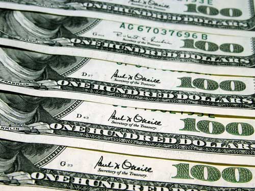 Drug-sniffing dogs find money-filled suitcase in storage unit; owners want it back