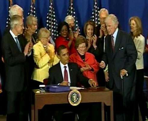 President Barack Obama signs the Serve America Act on Tuesday, April 21.