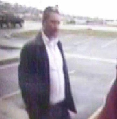 Police say Samuel Devargas, seen here in surveillance video, stole everything from wallets to cars from several real estate businesses.