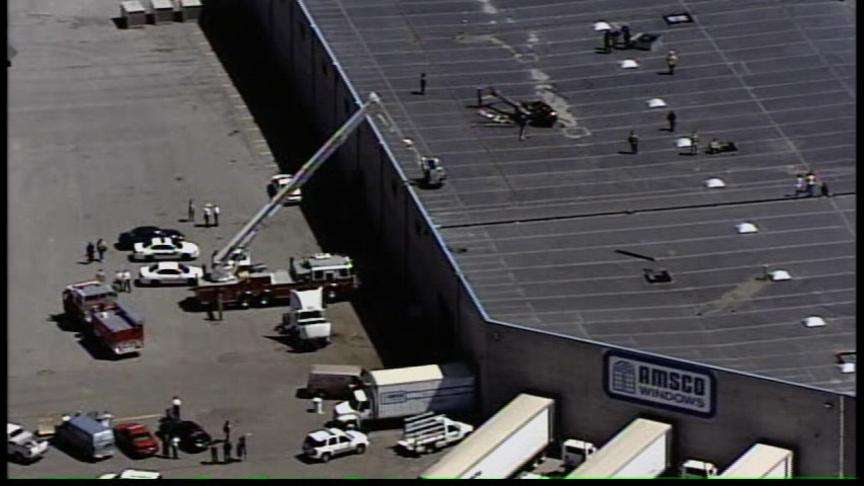 Helicopter Makes a Hard Landing on Roof of Business