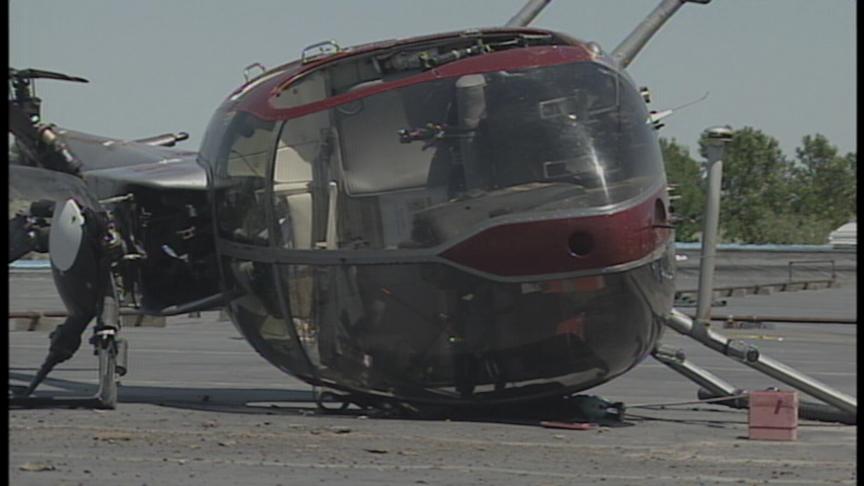 Helicopter Makes a Hard Landing on Roof of Business