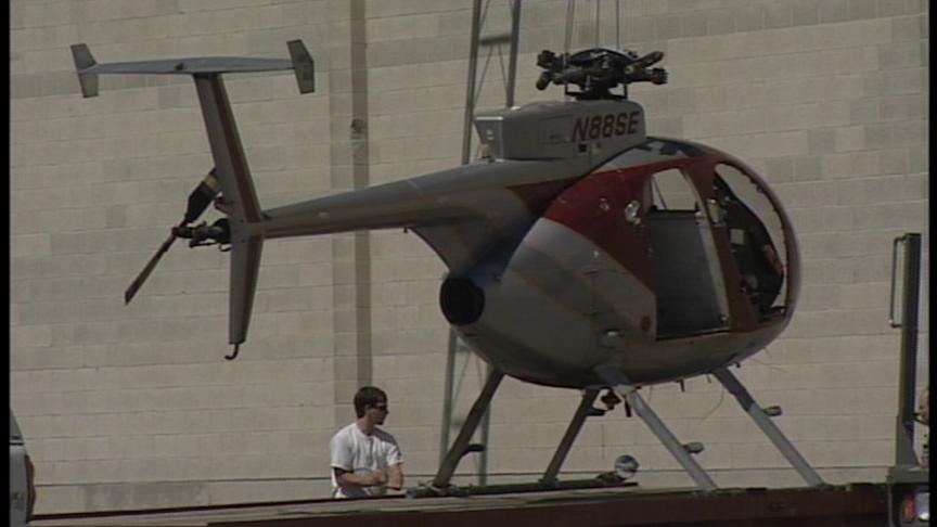 Helicopter Makes a Hard Landing on Roof of Business