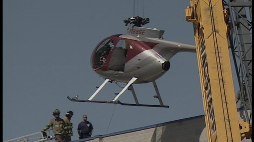 Helicopter Makes a Hard Landing on Roof of Business