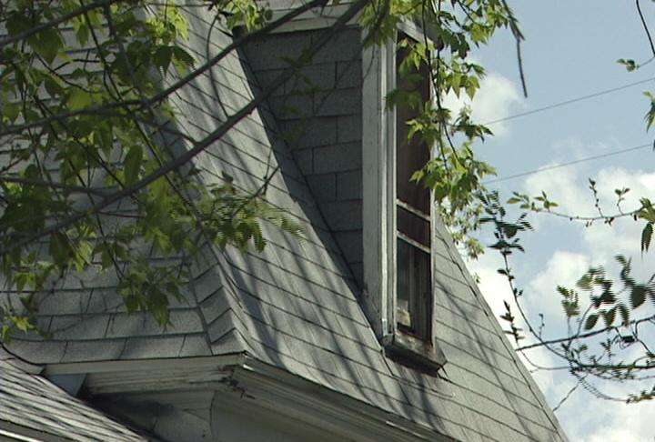 Police are investigating after two children crawled crawled out an open second-story window, and the 18-month-old fell off the roof.