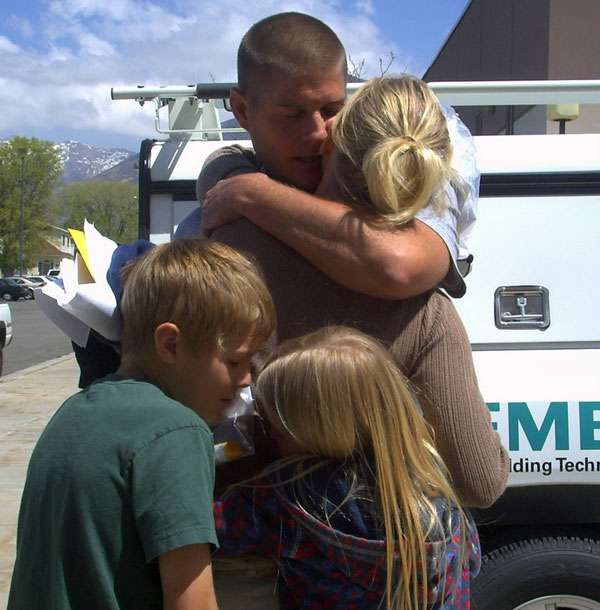 Susan Henwood is greeted by her husband and children after being released from jail. She had been behind bars for two days, a punishment she received for sending a questionable text message while in court.