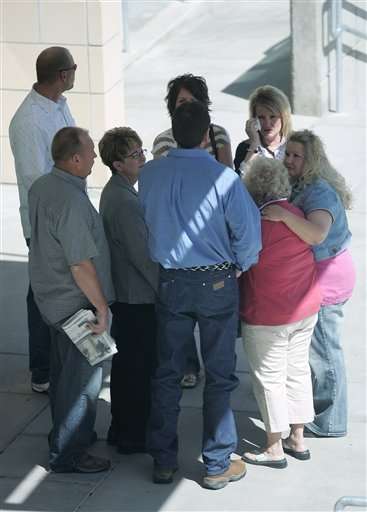Members and friends of the Baird family meet outside the Tooele County Courthouse after the sentencing of Lesile Baird Tuesday, April 17, 2007, in Tooele, Utah. Baird was sentenced to one year in jail and three years probation. (AP Photo/Troy Boman, Pool)