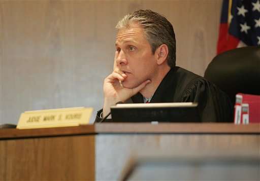 Third District Judge, Mark S. Kouris listens to Leslie Baird's final statement before sentencing, Tuesday April 17, 2007, in Tooele, Utah. Baird, a former Tooele County School District employee, was sentenced to one year in jail and three years probation for forcible sexual abuse of a 17-year-old male student. (AP Photo/Troy Boman, Pool)