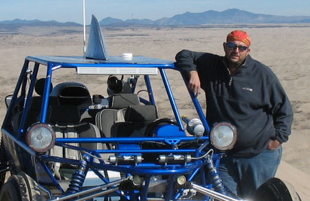 Chris Torres was seriously injured when his dune buggy rolled at the Little Sahara Sand Dunes last weekend. Still, he doesn't think the regulations should be placed on the recreation area.