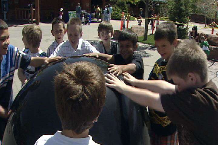 This wet, spinning ball at the Hogle Zoo illustrates how much kids love water. To take advantage of that interest, the zoo is hosting a "Water Fair" this week.