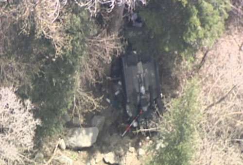 Woman drives over edge of road, falls 200 feet