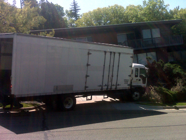 Runaway van hits hedges in front yard