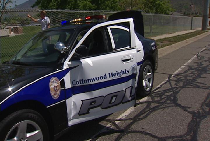 Patrol car nearly loses door during traffic stop