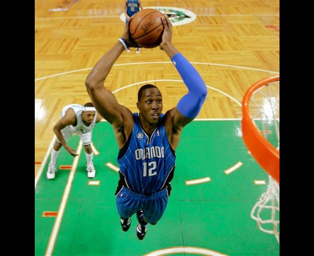 Orlando Magic's Dwight Howard goes in for the dunk during Orlando's 101-82 win in Game 7 in Boston on Sunday. (AP Photo/Winslow Townson)