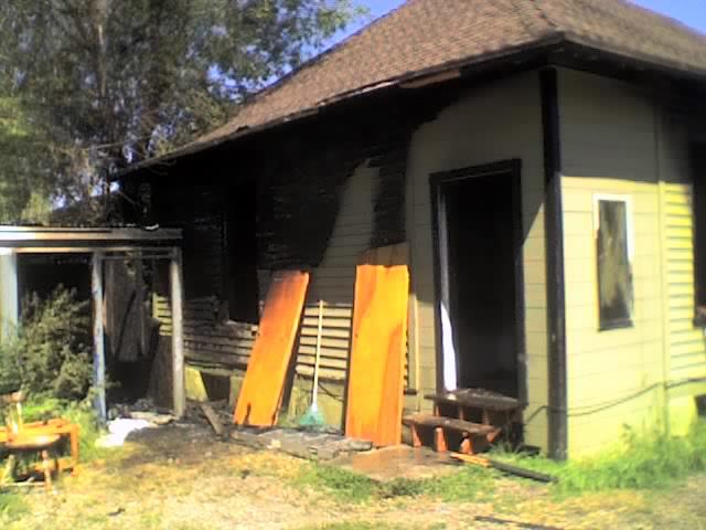 Rear portion of the vacant home at 271 28th St. after fire fighters put out the fire.
