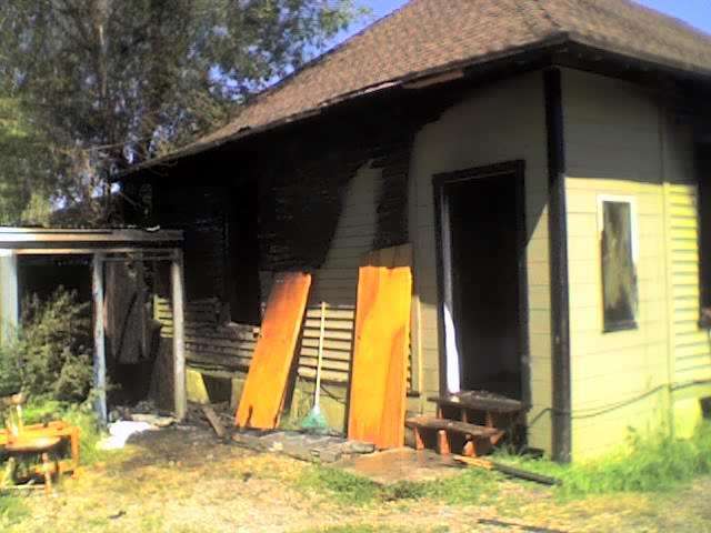Rear portion of the vacant home at 271 28th St. after fire fighters put out the fire.