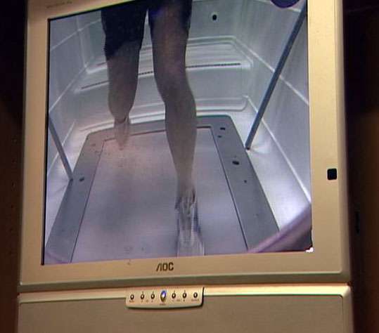 A television monitor shows how Dr. Dale Hull is able to run under water.