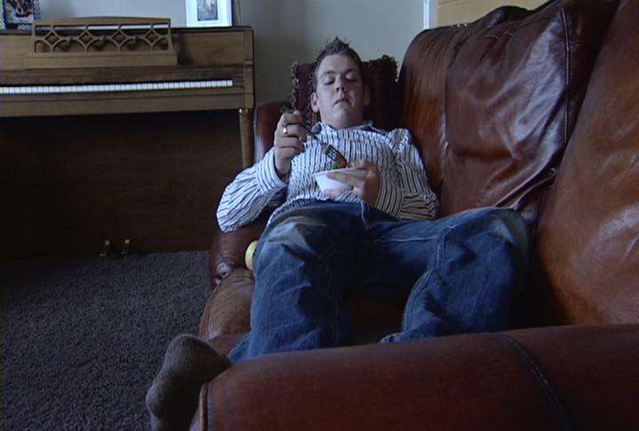 Lyme disease patient Ammon Livingston now spends roughly 80 percent of his time on this couch, too weak to move.