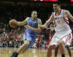 Utah Jazz guard Deron Williams (8) drives the ball past Houston Rockets center Yao Ming (11), during the fourth quarter.