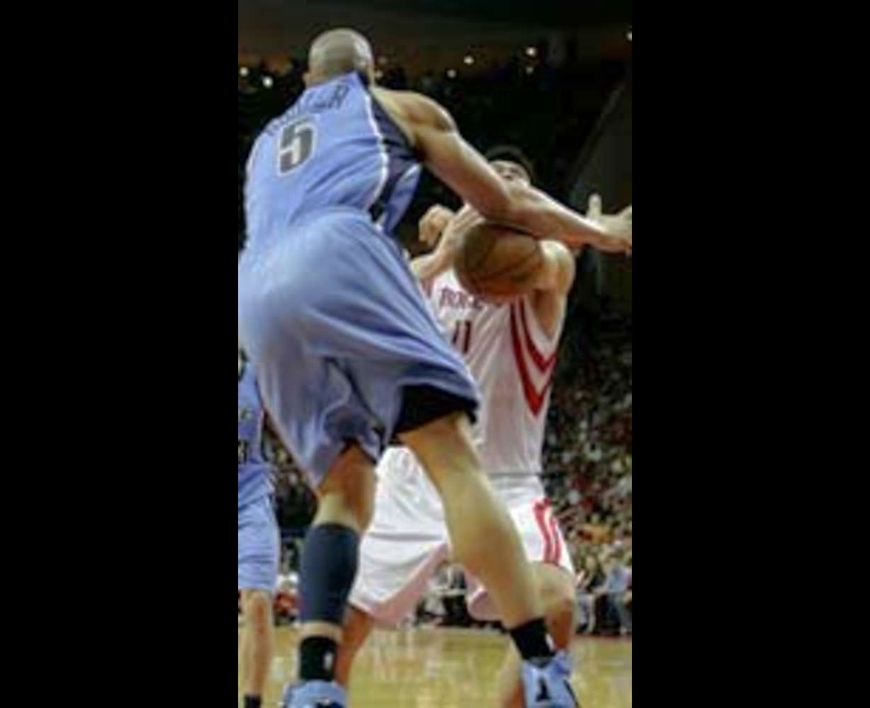 Utah Jazz forward Carlos Boozer (5) dislodges the ball from Houston Rockets center Yao Ming (11) of China in the first half in Game 7.