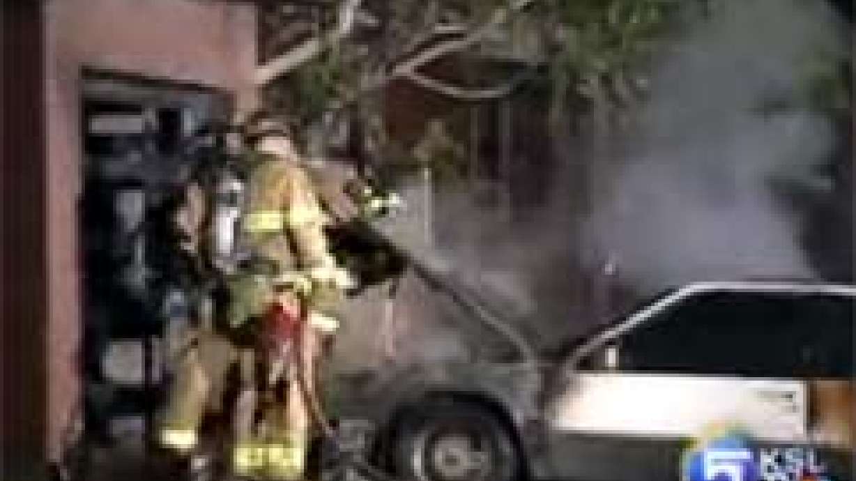 Fire Destroys Car in Driveway