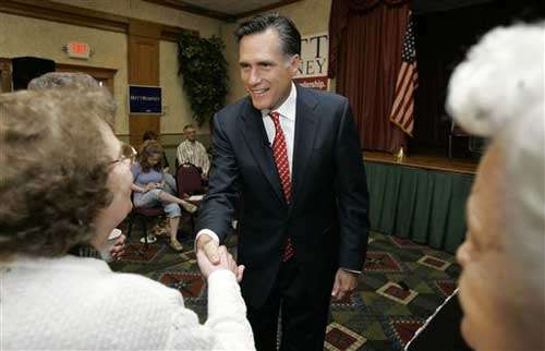 Republican presidential hopeful former Mass. Gov. Mitt Romney greets potential supporters before speaking at a caucus coffee, Wednesday, May 9, 2007, in Clear Lake, Iowa. (AP Photo/Charlie Neibergall)