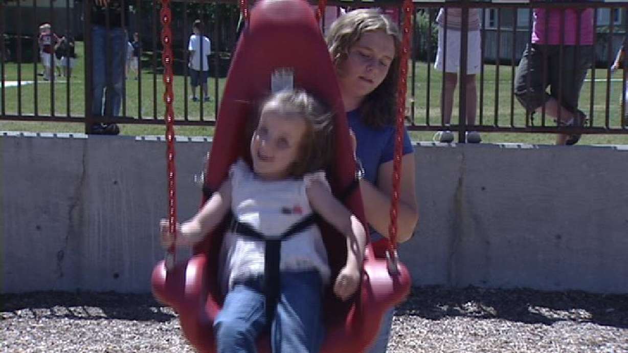 Special Swing Makes Recess Fun for Young Girl